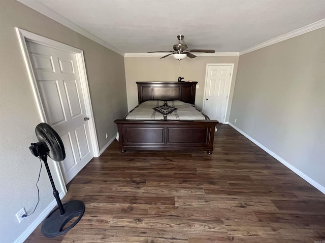 unfurnished bedroom with crown molding, ceiling fan, dark wood finished floors, and baseboards