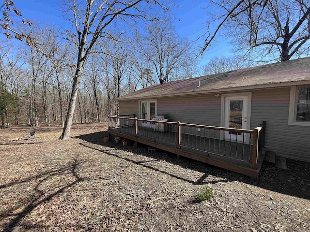 back of property featuring a deck