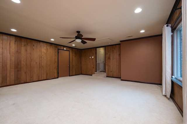 unfurnished room featuring recessed lighting, light colored carpet, visible vents, ornamental molding, and attic access