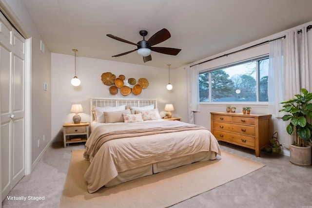 bedroom with a ceiling fan, light carpet, visible vents, and baseboards