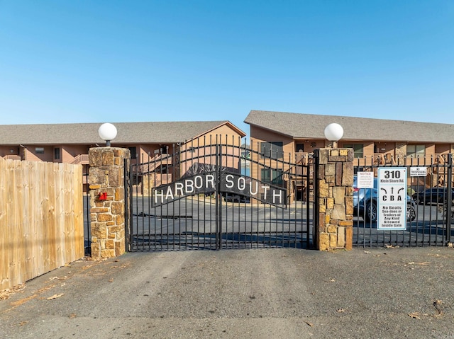 view of gate featuring fence