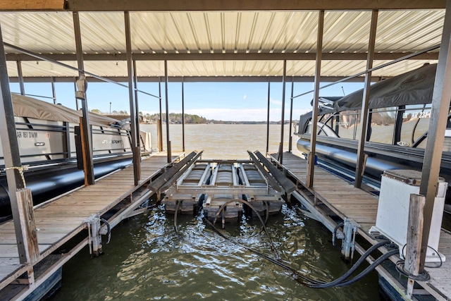 view of dock with a water view and boat lift