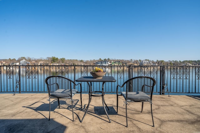 view of patio featuring a water view