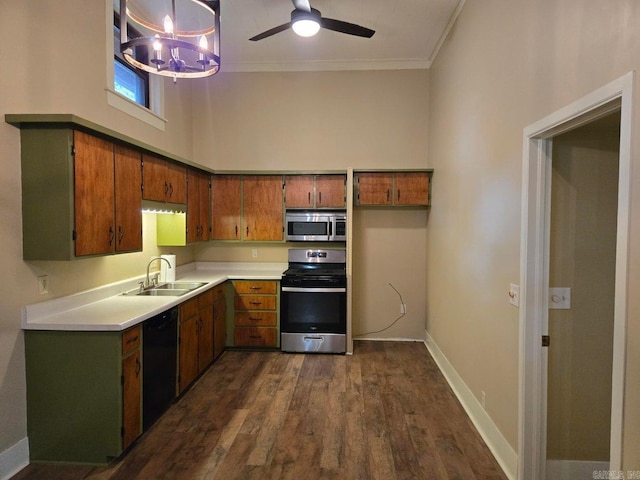 kitchen featuring stainless steel appliances, a sink, light countertops, and brown cabinets