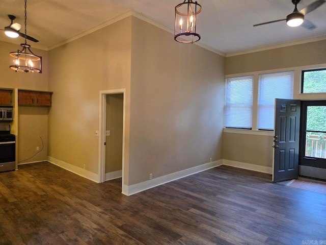 entrance foyer featuring dark wood-style flooring, crown molding, baseboards, and ceiling fan with notable chandelier