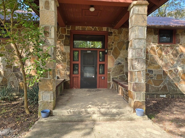 view of exterior entry with stone siding