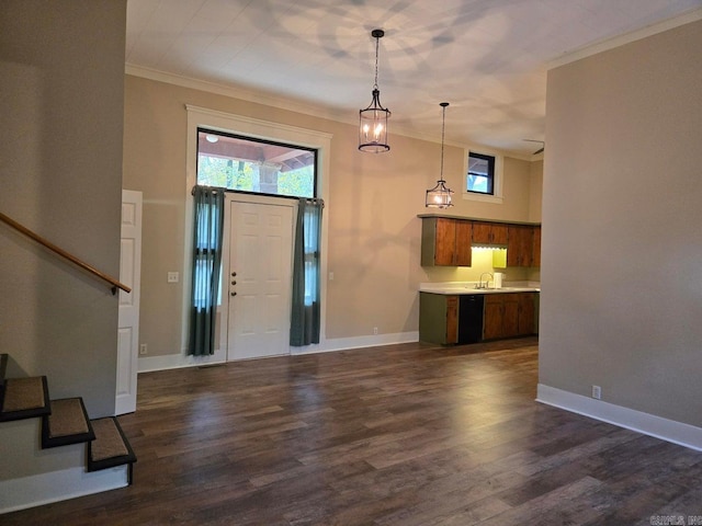 entryway featuring dark wood-style floors, ornamental molding, stairway, and plenty of natural light