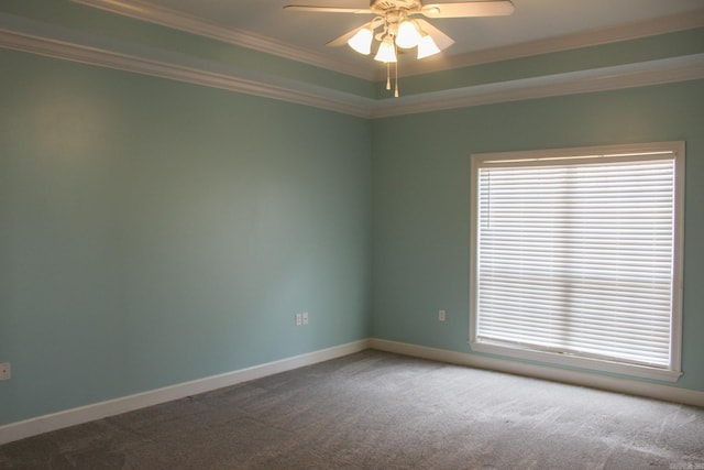 carpeted empty room featuring ornamental molding, a wealth of natural light, and baseboards