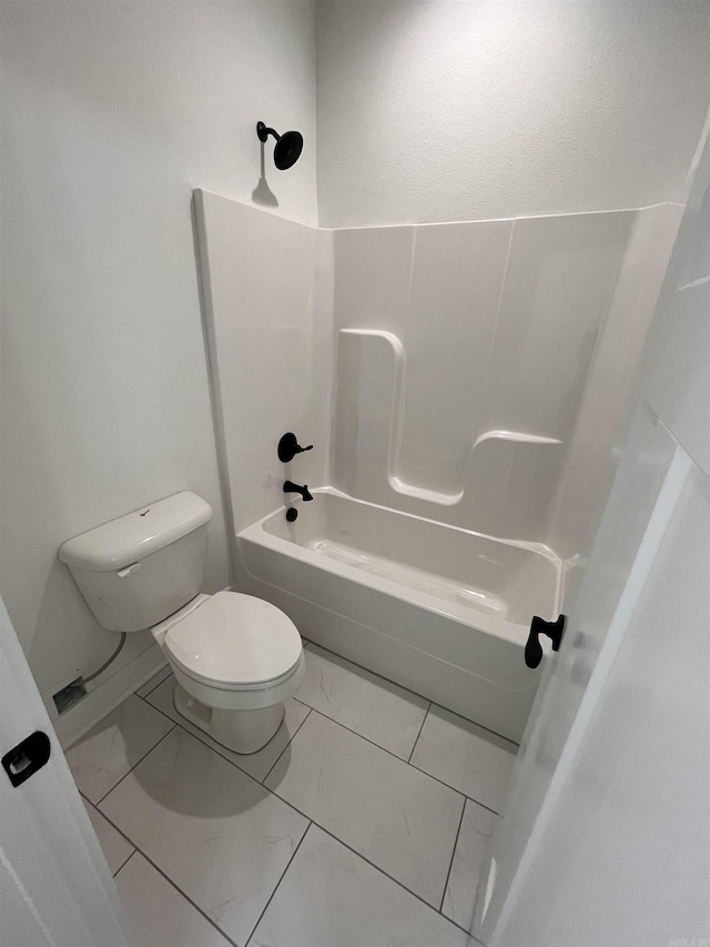 full bath with marble finish floor, shower / bathing tub combination, and toilet