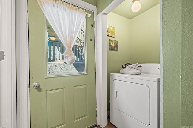 clothes washing area with laundry area and washer / dryer