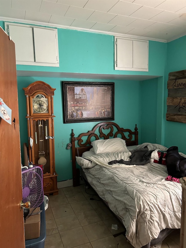 bedroom featuring tile patterned flooring