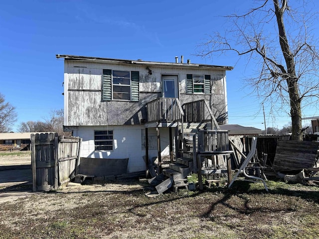 back of property with fence