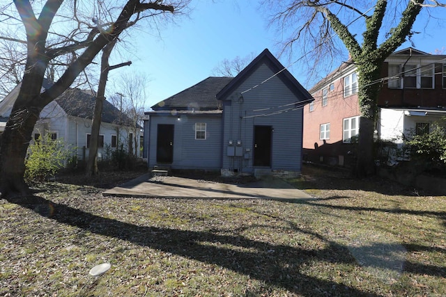 rear view of property featuring entry steps and a patio