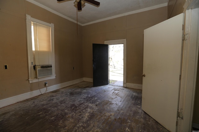 unfurnished room with ornamental molding, hardwood / wood-style flooring, and baseboards