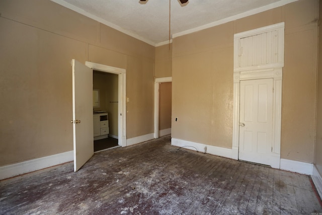 unfurnished bedroom featuring ornamental molding and baseboards