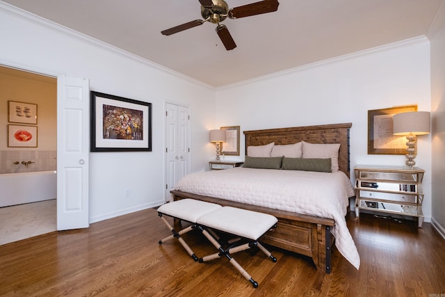 bedroom featuring ornamental molding and wood finished floors