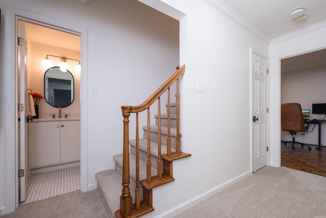 stairs featuring ornamental molding, carpet flooring, and baseboards