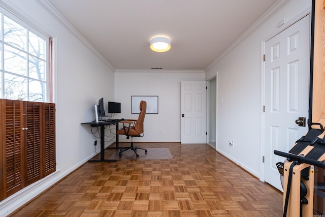 home office featuring baseboards, visible vents, and crown molding