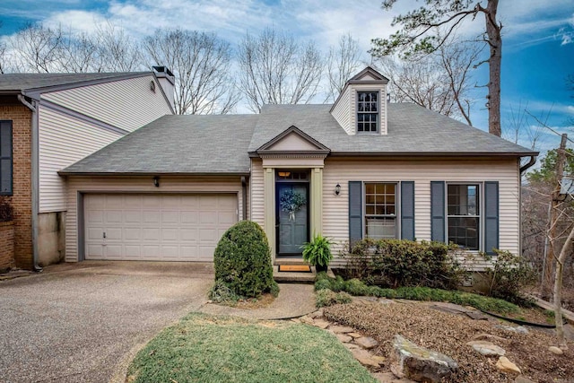 view of front of home with a garage and driveway