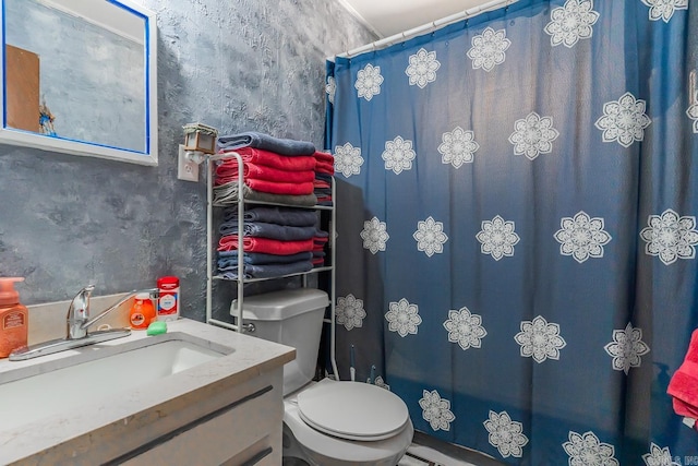 full bathroom with toilet, curtained shower, and vanity