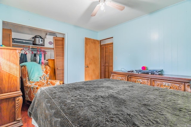 bedroom with ceiling fan and a closet