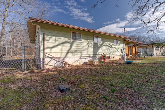 view of side of property featuring crawl space, fence, and central air condition unit