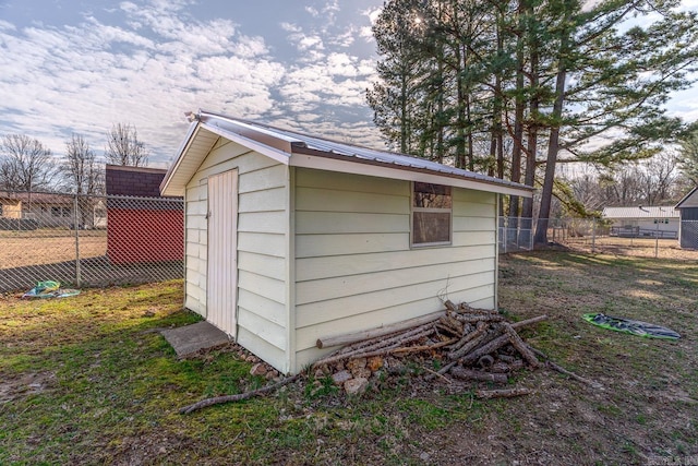 view of shed featuring fence