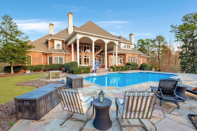 outdoor pool featuring a patio area