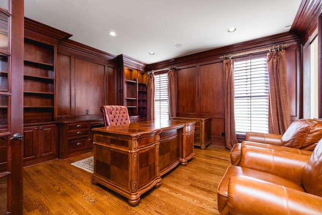 office space featuring ornamental molding, light wood-style flooring, and recessed lighting