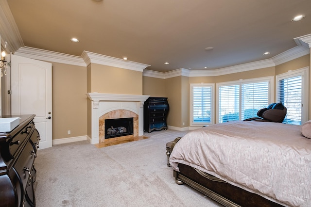 bedroom with carpet floors, recessed lighting, ornamental molding, a high end fireplace, and baseboards