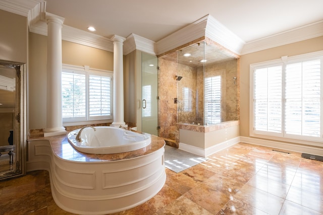 full bath featuring crown molding, a stall shower, a garden tub, and decorative columns