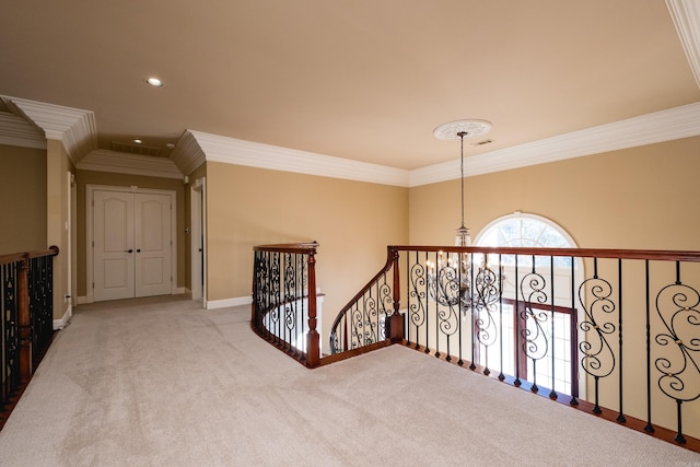 corridor featuring carpet floors, recessed lighting, ornamental molding, an upstairs landing, and baseboards