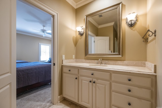 ensuite bathroom featuring vanity, visible vents, and crown molding