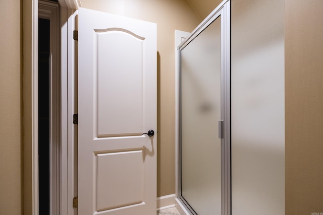 full bathroom featuring a stall shower