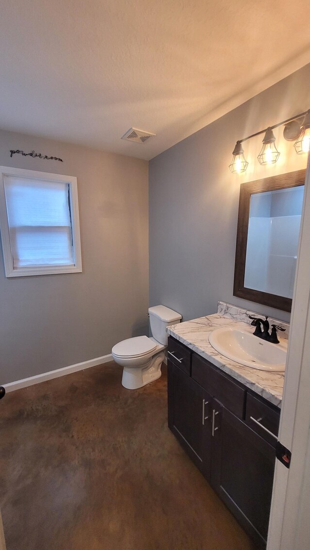 1108 Ava Ln, Paragould, AR 72450 - half bath featuring baseboards, visible vents, vanity, and toilet