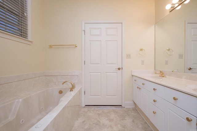 full bathroom featuring double vanity, a tub with jets, and a sink