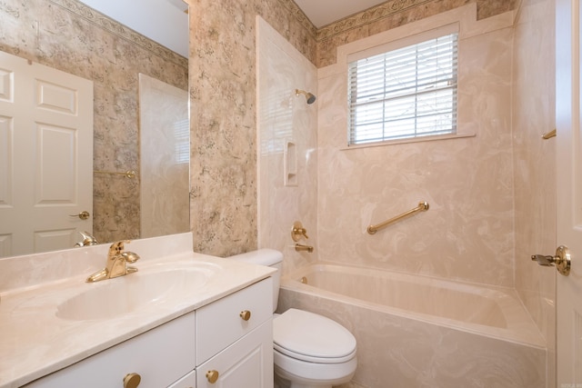 full bath with  shower combination, vanity, toilet, and wallpapered walls