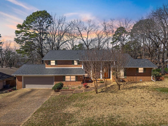 mid-century inspired home with a garage, concrete driveway, roof with shingles, crawl space, and brick siding