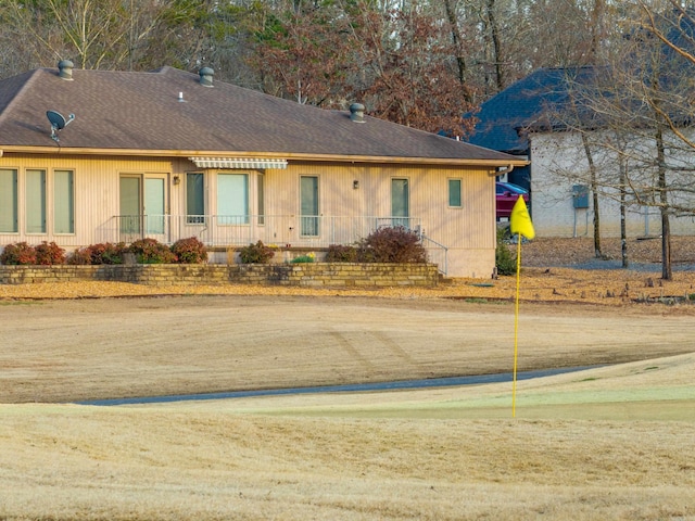 view of front of property with roof with shingles