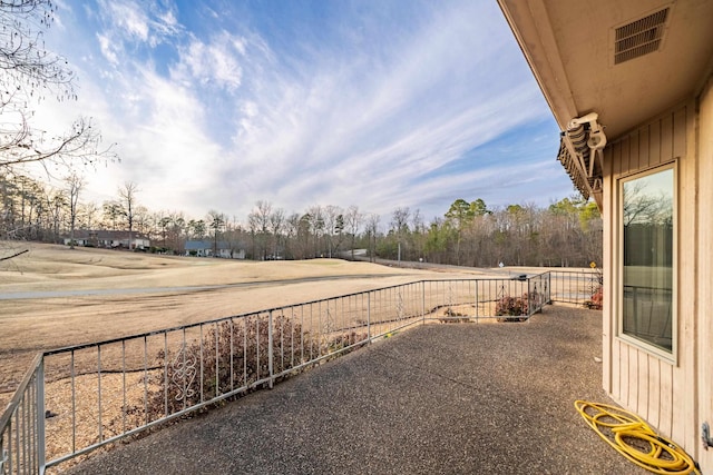 view of yard with visible vents and fence