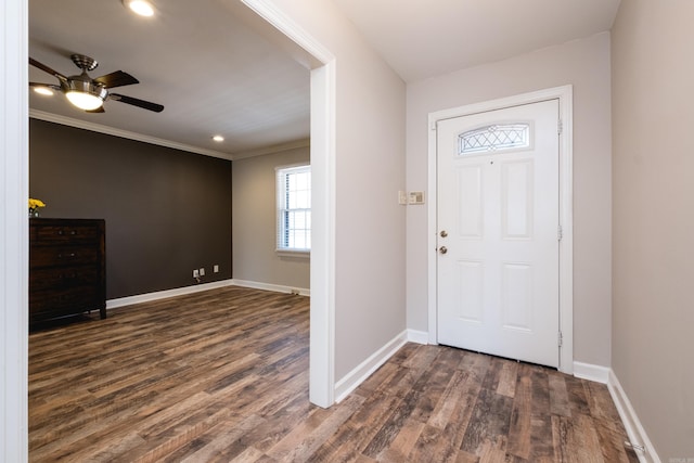 entrance foyer with dark wood-style floors, ceiling fan, baseboards, and ornamental molding