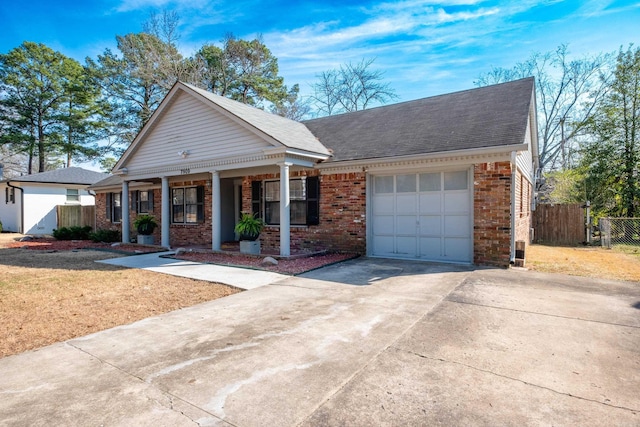 neoclassical home with a garage, covered porch, brick siding, fence, and concrete driveway