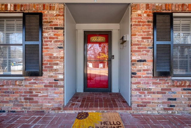 entrance to property with brick siding