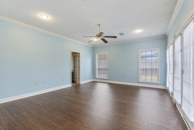 unfurnished room with crown molding, baseboards, ceiling fan, and dark wood-type flooring