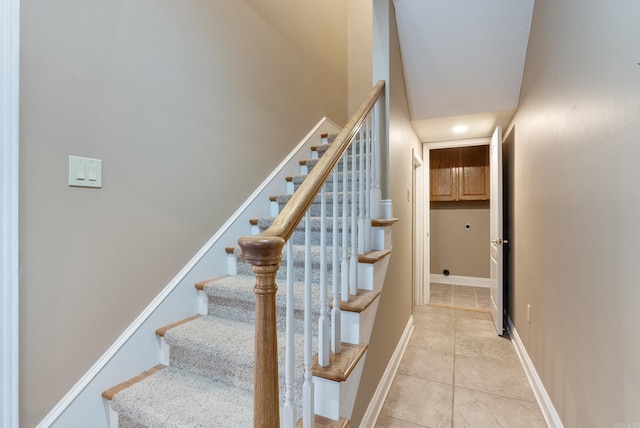 stairs with tile patterned flooring and baseboards