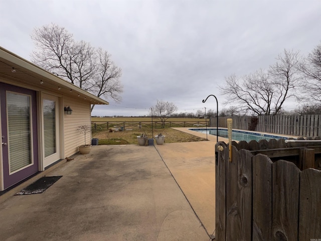 view of patio featuring a fenced backyard and a fenced in pool