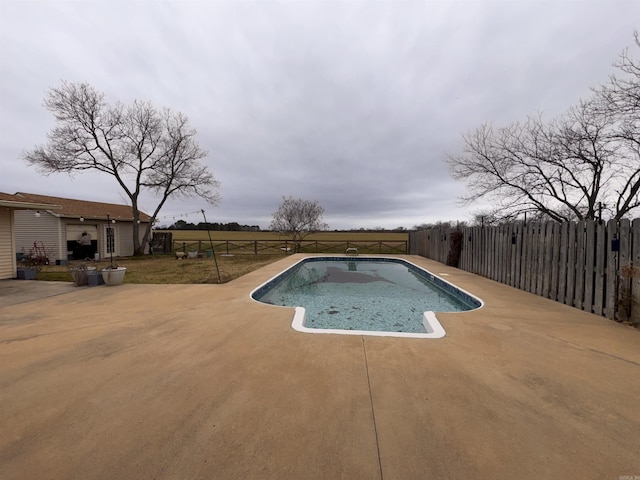 view of pool featuring a patio, a fenced backyard, and a fenced in pool