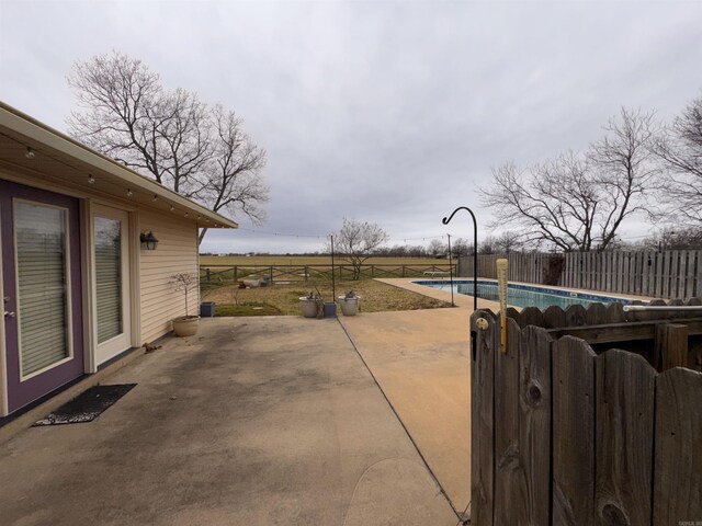 view of patio with a fenced in pool and a fenced backyard