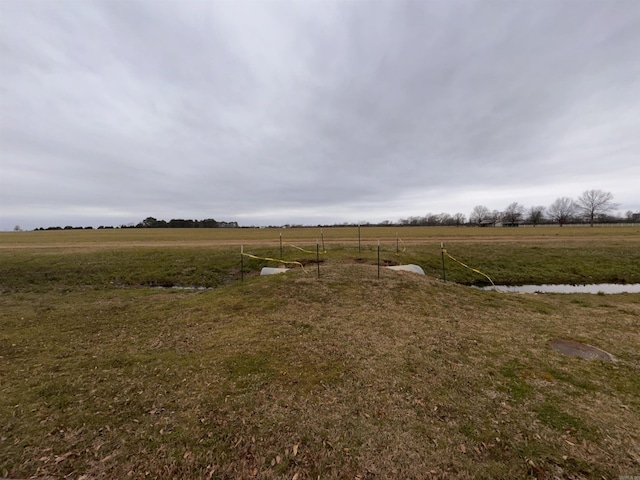 view of yard with a rural view