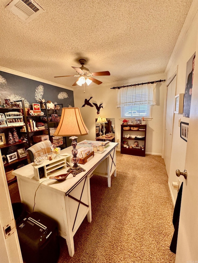 carpeted bedroom featuring a textured ceiling, ceiling fan, ornamental molding, and visible vents